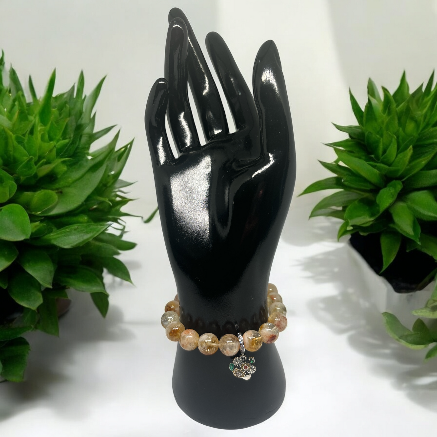 Citrine stone bracelet featuring a sterling silver basket of flowers charm.