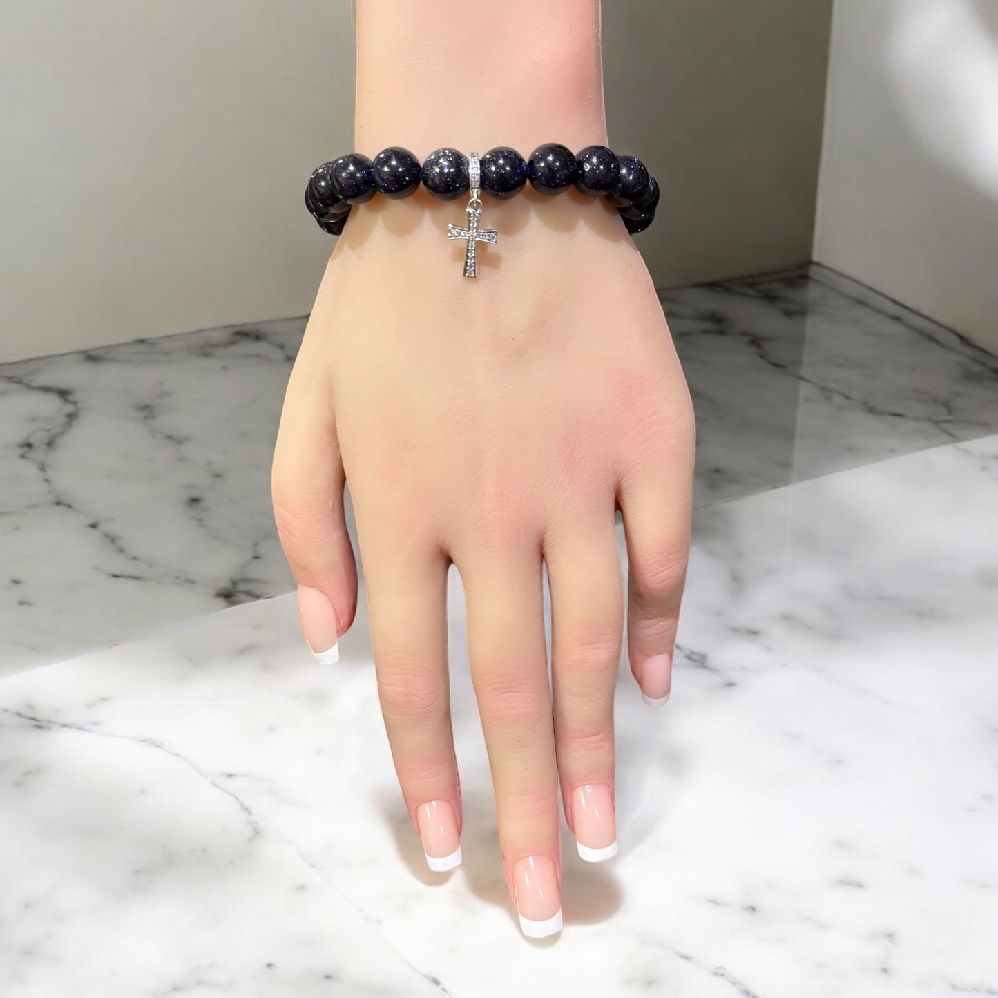 Blue Sandstone Bracelet featuring a Stirling Silver and simulated Zircon cross charm