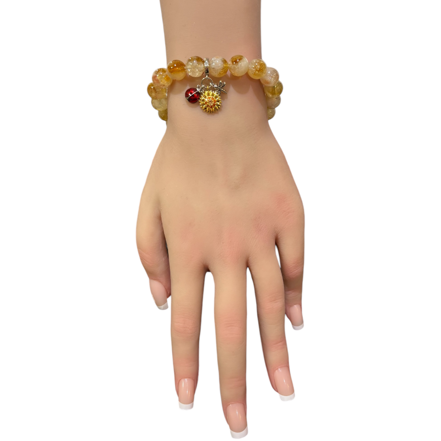 Citrine stone bracelet featuring a silver-plated charm adorned with an enamel sunflower, dragonfly, and ladybug