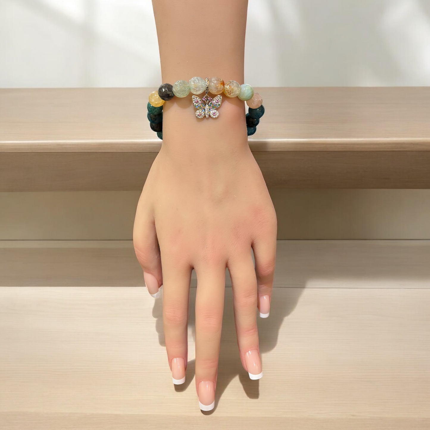 Apatite and Aquamarine Bracelet featuring a Silver-Plated Butterfly Charm adorned with Coloured Crystals