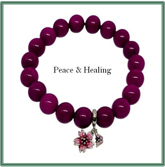 Pink Sugilite Bracelet and Silver-plated charm with a pink enamel flower and butterfly.