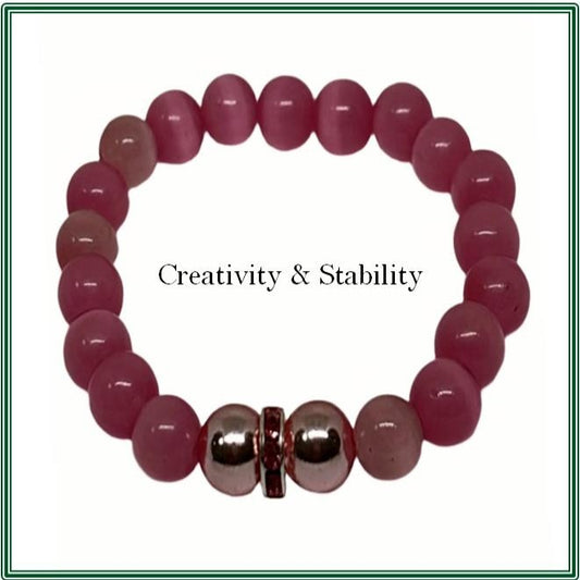 Pink Cat's Eye stone bracelet with treated pink Hematite and pink rondelle accents.