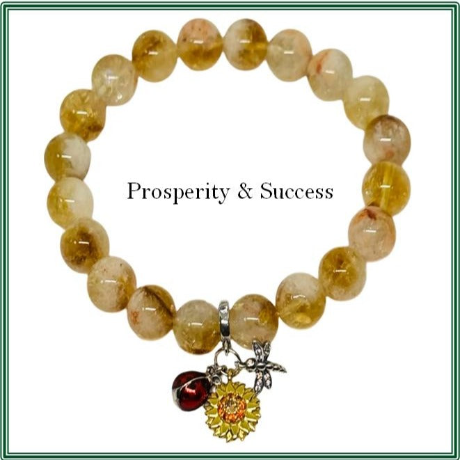 Citrine stone bracelet featuring a silver-plated charm adorned with an enamel sunflower, dragonfly, and ladybug
