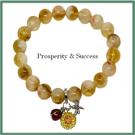 Citrine stone bracelet featuring a silver-plated charm adorned with an enamel sunflower, dragonfly, and ladybug