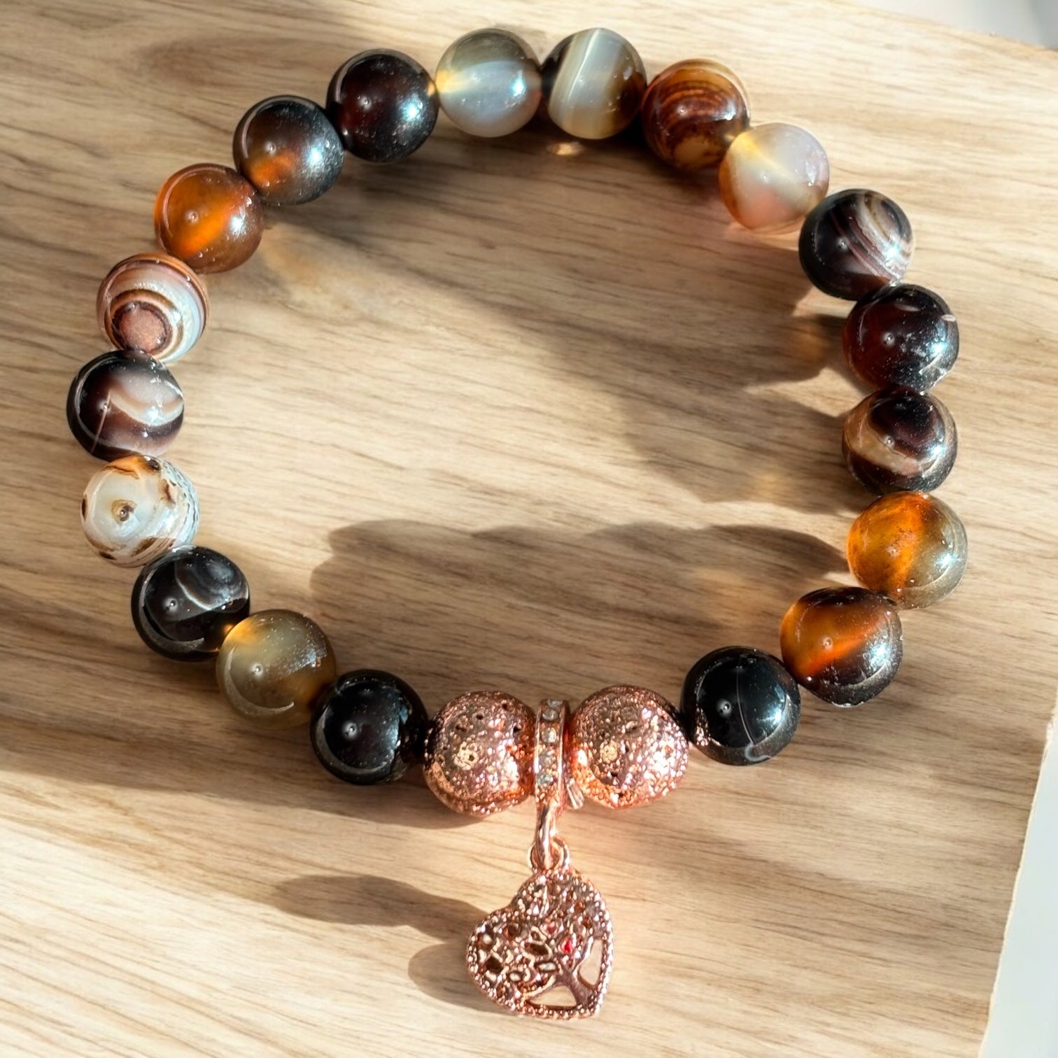 Brown Striped Agate Bracelet with Rose gold treated Lava rock and brass charm
