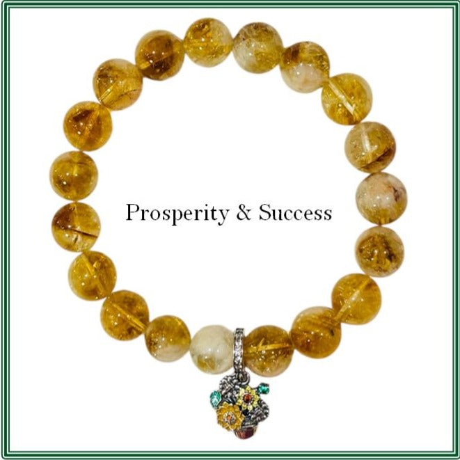 Citrine stone bracelet featuring a sterling silver basket of flowers charm.